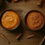 Is Pumpkin Mix and Pumpkin Puree The Same? 7 Essential Differences – side-by-side comparison of pumpkin puree and pumpkin mix in wooden bowls, surrounded by fall-themed decor like cinnamon sticks and autumn leaves.